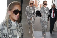 Rita Ora in Visor Sunglasses and a Grey Suit lands in London