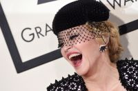 Sexual Harassment? Madonna Pulls Down a Fan's Top