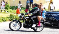 Beyonce and Jay-Z riding a motorcycle