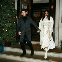 While the snow is falling: Priyanka Chopra in a white silk dress and milk coat