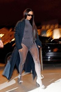 Kim Kardashian wore Versace tights on top of a shiny body