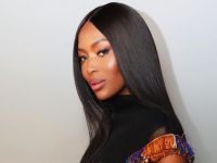 Naomi Campbell dances with children from South Africa
