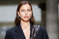 Irina Shayk in a bright hood on the Hudson waterfront
