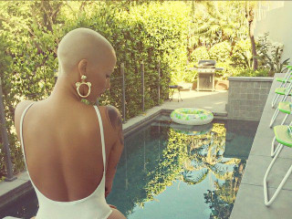 Amber Rose uploads a Photo Poolside in a Tiny Swimsuit