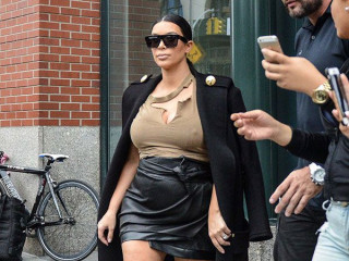 Pregnant Kim Kardashian comes to a Fashion Week in a Leather Mini