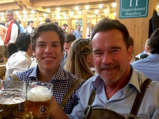 Arnold Schwarzenegger And Joseph Baena Travel To Oktoberfest
