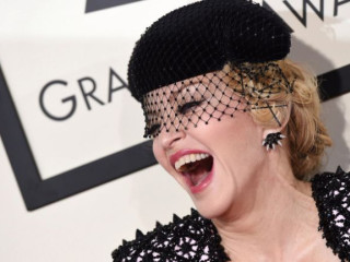 Sexual Harassment? Madonna Pulls Down a Fan's Top