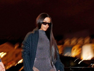 Kim Kardashian wore Versace tights on top of a shiny body