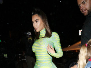 Kim Kardashian showed a built figure in a tight mini