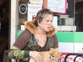 Mickey Rourke with a cute dog visited the cafe
