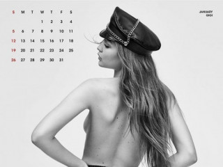 24-year-old Gigi Hadid poses topless on a calendar cover