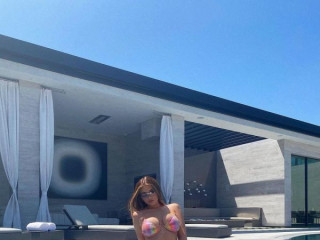 Kylie Jenner on a rainbow swimsuit  