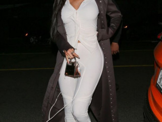 Kylie Jenner accentuates her sexy body in a white suit