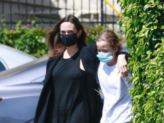 Angelina Jolie is back in noir offense on a walk with her daughter