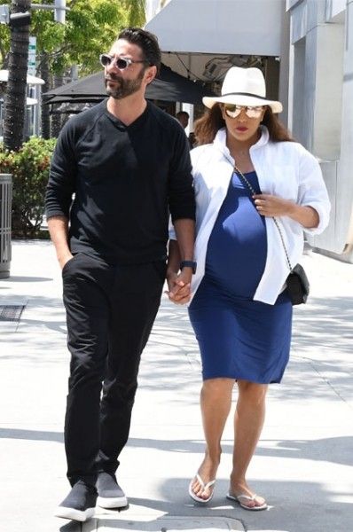 Pregnant Eva Longoria hit the paparazzi lens on a walk with her husband
