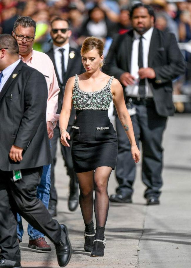 Scarlett Johansson was surprised by a figure in a mini-dress