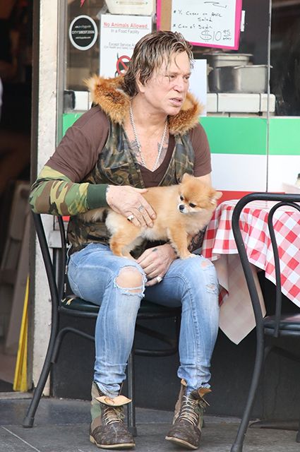 Mickey Rourke with a cute dog visited the cafe