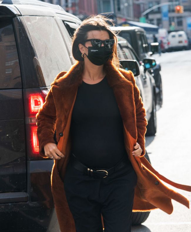 Emily Ratajkowski tried on a fluffy coat in New York City