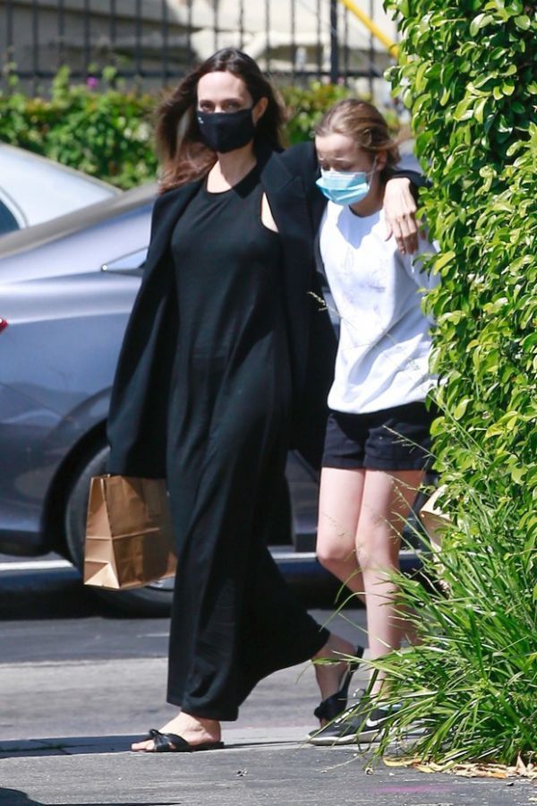 Angelina Jolie is back in noir offense on a walk with her daughter